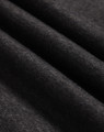 Close-up of charcoal grey fleece fabric showing soft brushed texture and diagonal folds