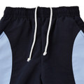 Navy straight leg track pants with sky blue side panels, elasticated waistband and white rope drawcord