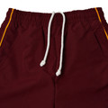 Maroon microfibre track pants with gold piping, elasticated waistband, white drawcord and side pockets