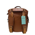 Brown canvas convertible nappy backpack with adjustable straps, multiple front pockets, and flap-over closure with buckles