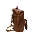 Brown leather convertible nappy bag backpack with roll-top closure and adjustable shoulder straps, side view