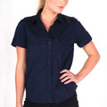 Women's navy short sleeve military shirt with epaulettes, twin chest pockets, and button-through front on model