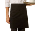 Black short waist apron with front pocket worn by server holding a tray, hospitality setting
