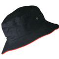Black bucket hat with contrasting red underside brim and metal eyelet