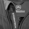Charcoal ladies stretch soft shell jacket with contrast grey hood lining and Stormtech branding on zipper tape