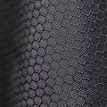 Close-up of charcoal hexagonal honeycomb thermal weave fabric on technical outer shell jacket