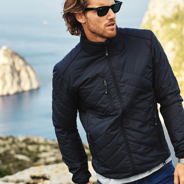 Navy quilted puffer jacket with stand collar, zip chest pocket and diagonal quilting pattern