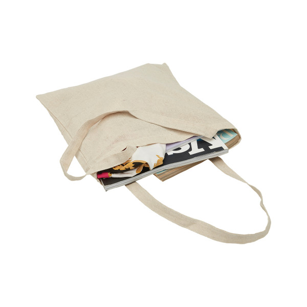 Natural hemp tote bag with long shoulder straps and magazine visible inside