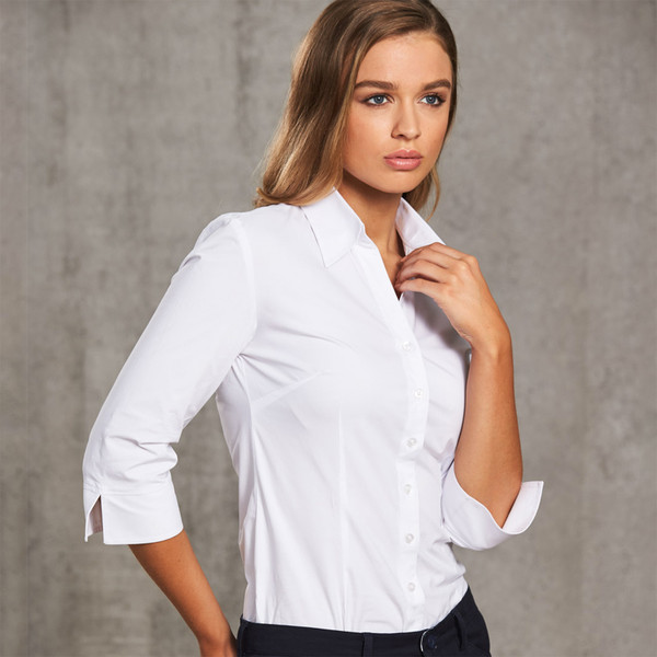 Woman wearing white stretch shirt with spread collar, button front and three-quarter sleeves with split cuffs