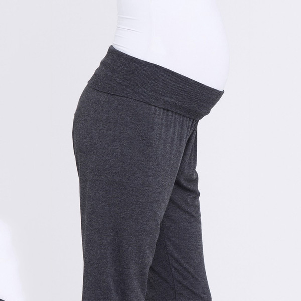 Charcoal grey maternity lounge pants with wide fold-over waistband shown in side profile
