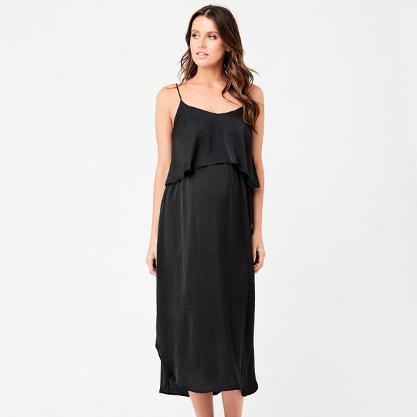 Model wearing black satin-finish midi slip dress with layered ruffle bodice and thin shoulder straps