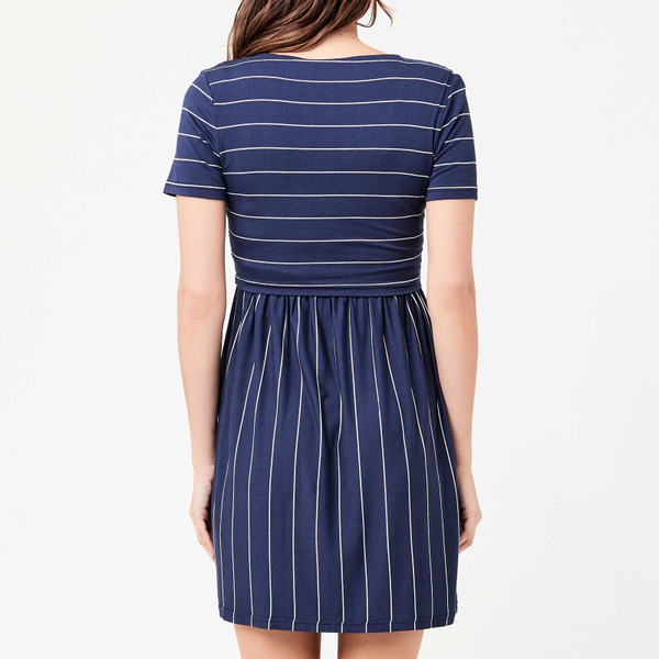 Model wearing indigo stripe nursing dress, short sleeves, contrast horizontal bodice and vertical skirt panels