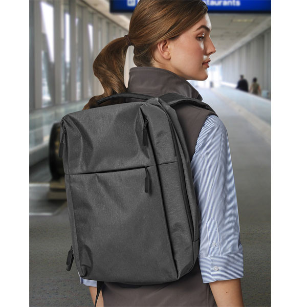 Charcoal heather backpack with padded laptop compartment and adjustable straps worn over blue striped shirt