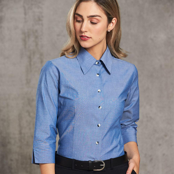 Light blue chambray women's shirt with three-quarter sleeves, collar and front button placket