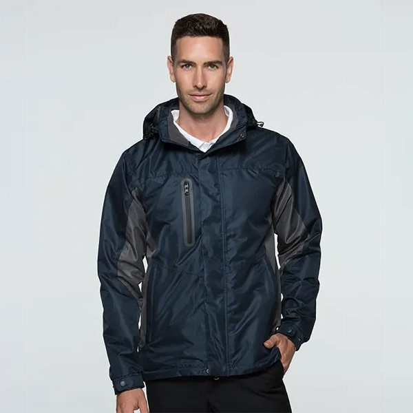 Navy waterproof jacket with charcoal contrast sleeves, chest pocket and adjustable hood with brushed fleece lining