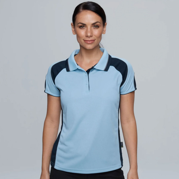 Woman wearing sky blue and navy contrast panel short sleeve polo with ribbed collar and three-button placket
