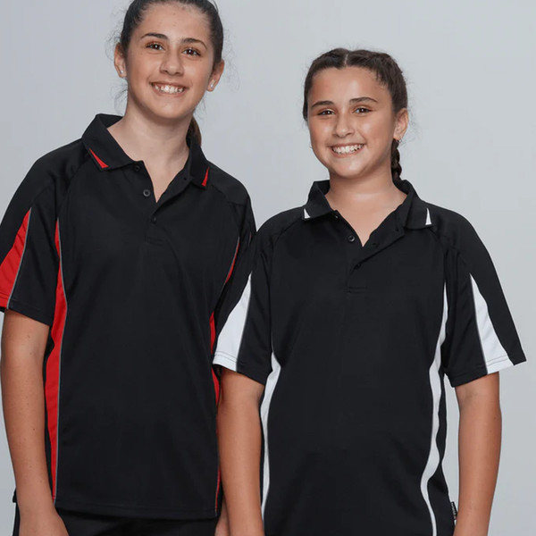 Two girls wearing black contrast sports polo shirts — one with red side panels, one with white, three-button plackets