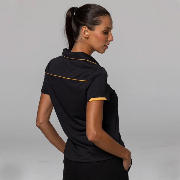 Black ladies polo shirt with gold piping detail on collar, sleeves and back yoke, shown from rear angle