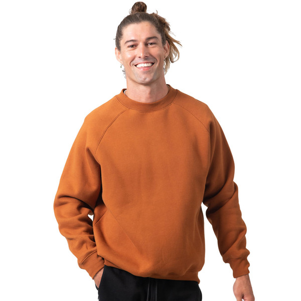 Burnt orange crew neck sweater with raglan sleeves and ribbed cuffs on white background