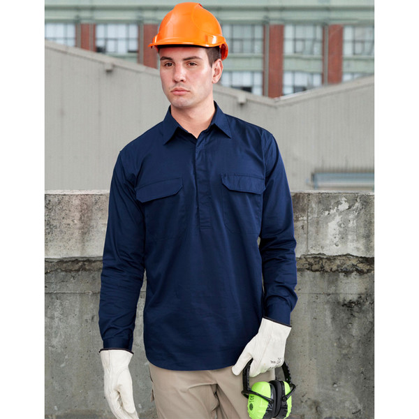 Navy work shirt with dual chest flap pockets and long sleeves on model wearing orange hard hat
