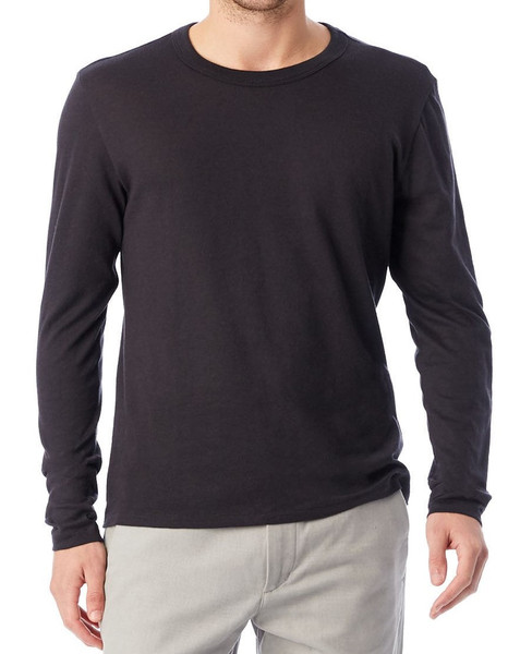 Man wearing a charcoal long sleeve crew neck tee with clean flat front panels and ribbed cuffs