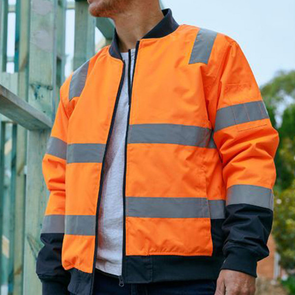Man wearing orange and navy hi vis bomber jacket with silver reflective tape bands and zip front