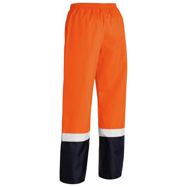 Hi-vis orange waterproof work pants with white reflective tape and navy blue lower legs featuring elastic waistband