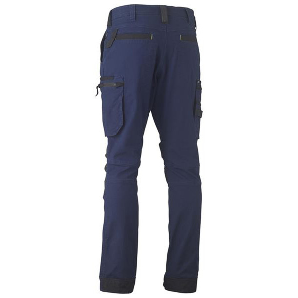 Navy stretch cargo pants rear view, contrast charcoal zip pockets, multi-pocket utility design, tapered leg