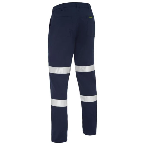 Navy work pants with double silver reflective tape bands around lower legs, rear view showing taped hi-vis design