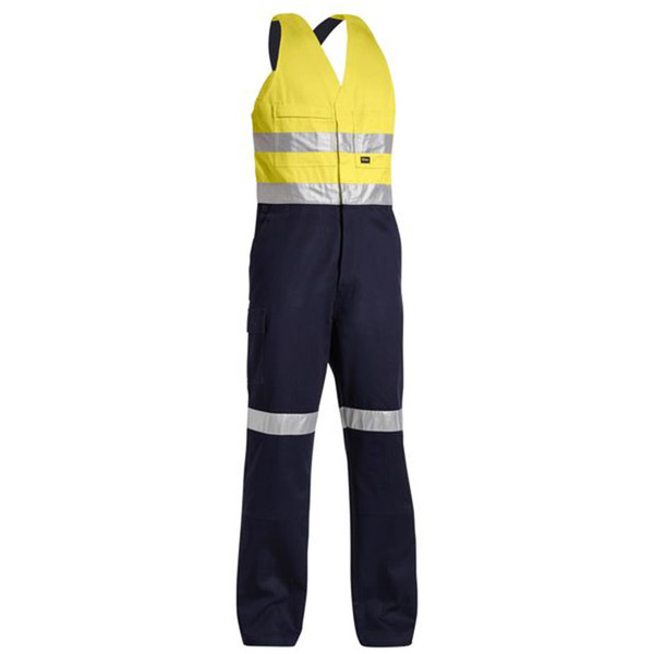Hi-vis yellow and navy action back overall with silver reflective tape on torso and legs