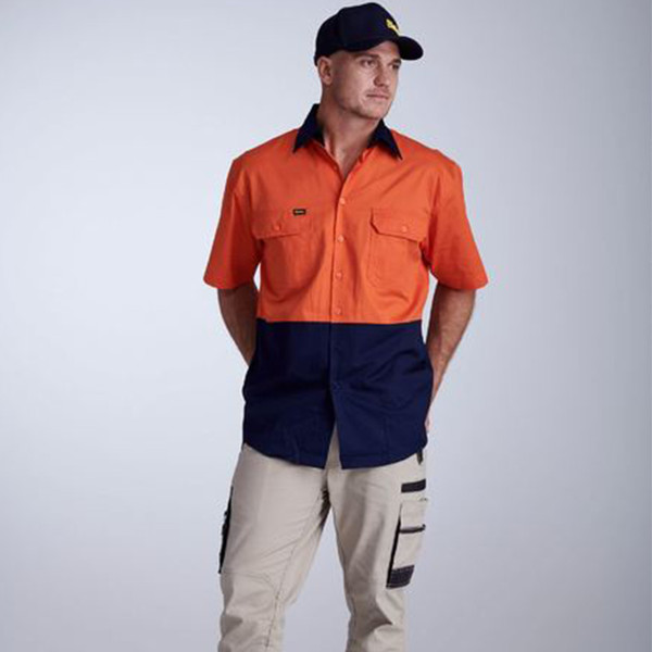 Orange and navy hi-vis work shirt with short sleeves, chest pockets with flaps, and button front closure