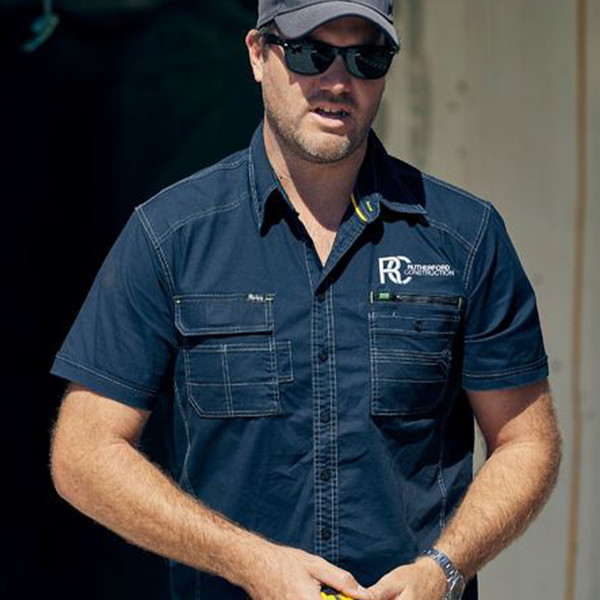 Navy blue short sleeve work shirt with chest pockets and contrast topstitching