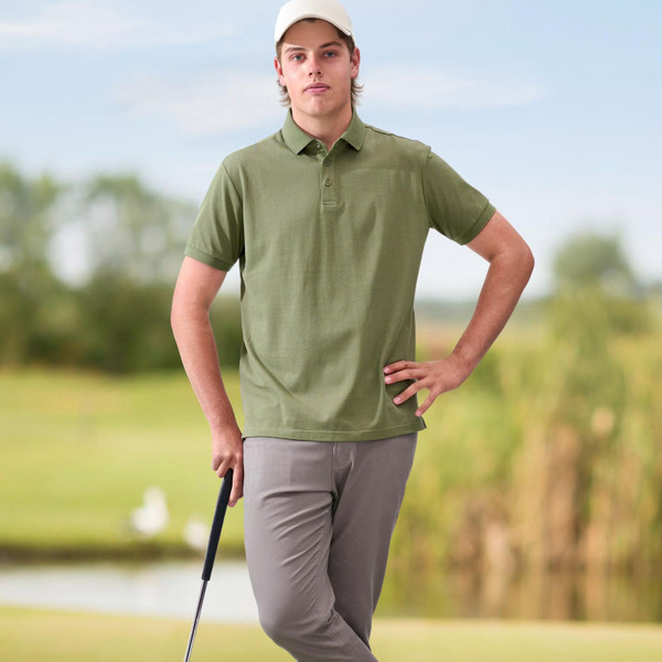 Sage green pique polo shirt with collar and short sleeves on outdoor background