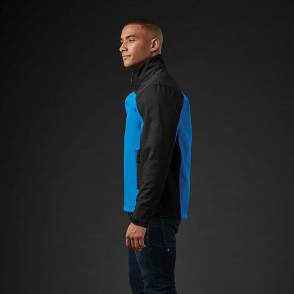 Black and electric blue contrast panel softshell jacket with stand collar, shown from side view