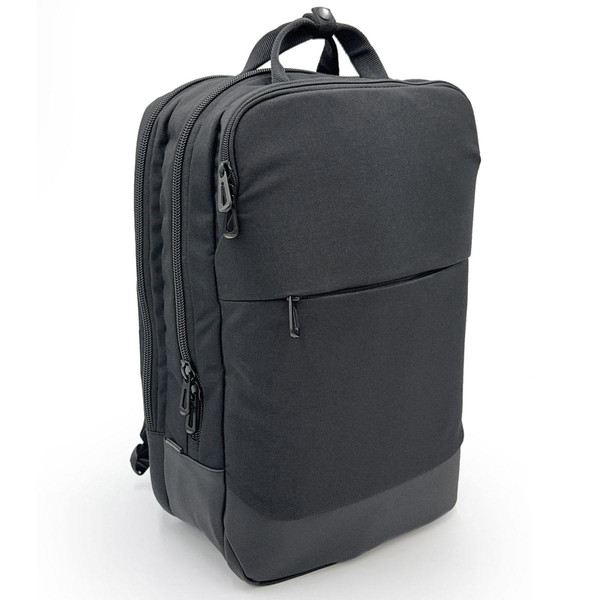 Charcoal black 22L commuter backpack with textured fabric body, leather-look base panel, and twin zip compartments
