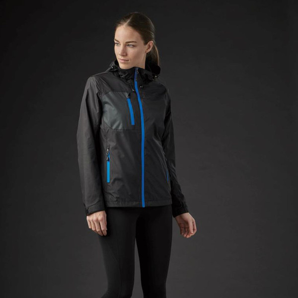 Woman wearing charcoal waterproof shell jacket with cobalt blue zip and chest pocket contrast detailing