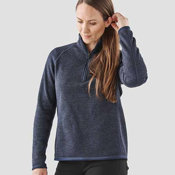 Woman wearing navy marl quarter-zip fleece pullover with raglan sleeves and contrast zip