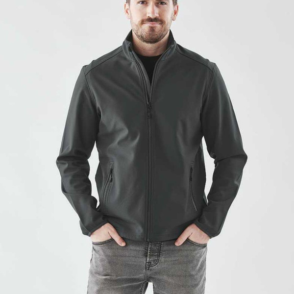 Man wearing charcoal full-zip softshell jacket with stand collar and zippered side pockets