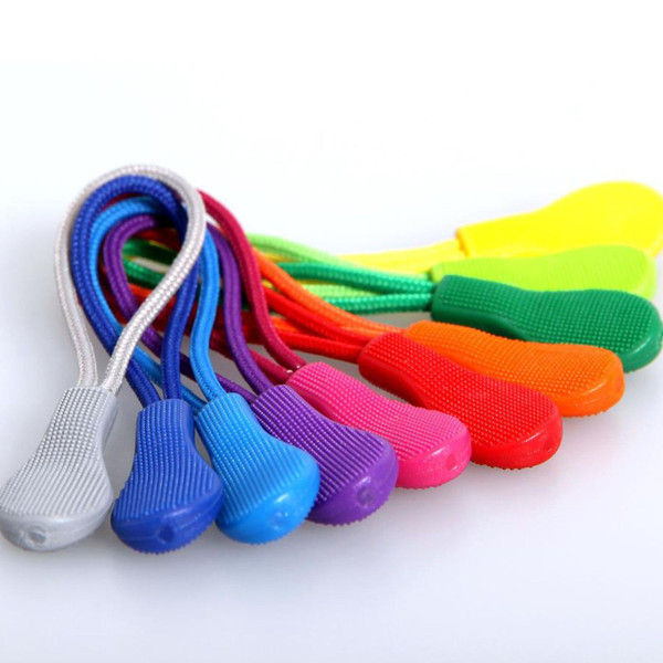 Fan of colourful zip pullers in white, blue, purple, red, orange, pink, green and yellow with textured rubber grip tabs