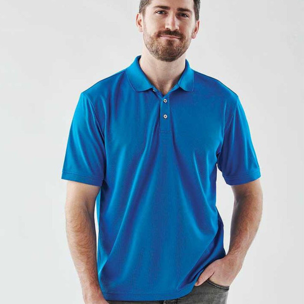 Man wearing a royal blue snag-resistant performance polo with three-button placket and classic collar