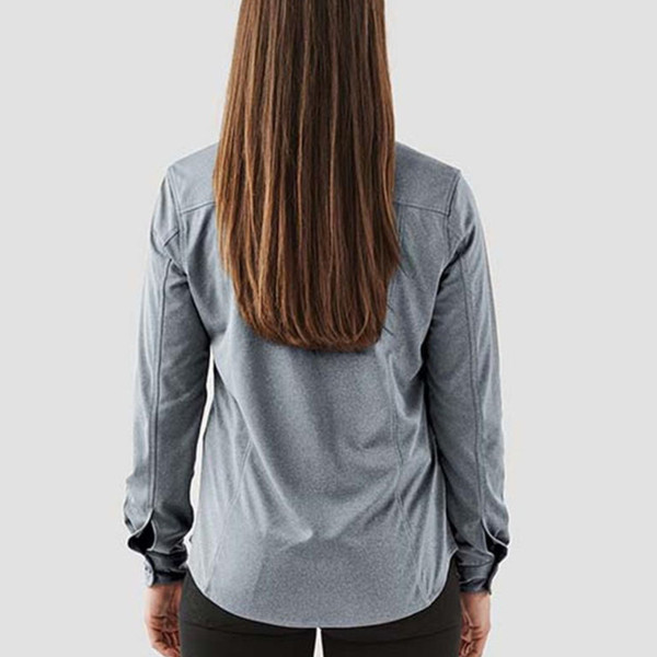 Rear view of woman wearing a slate grey long sleeve performance shirt with shoulder seam detailing and cuffed wrists