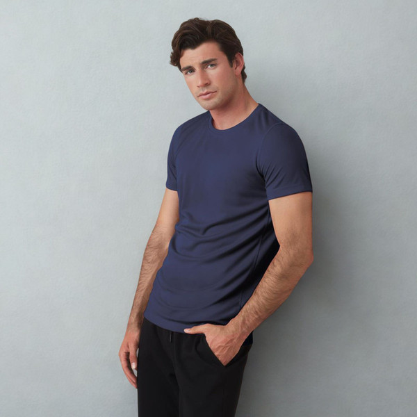 Man wearing a navy blue slim-fit crew neck active tee with short sleeves and smooth stretch fabric