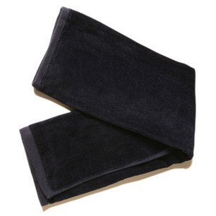 Black cotton terry velour golf towel with beige trim folded to show texture and hemmed edges