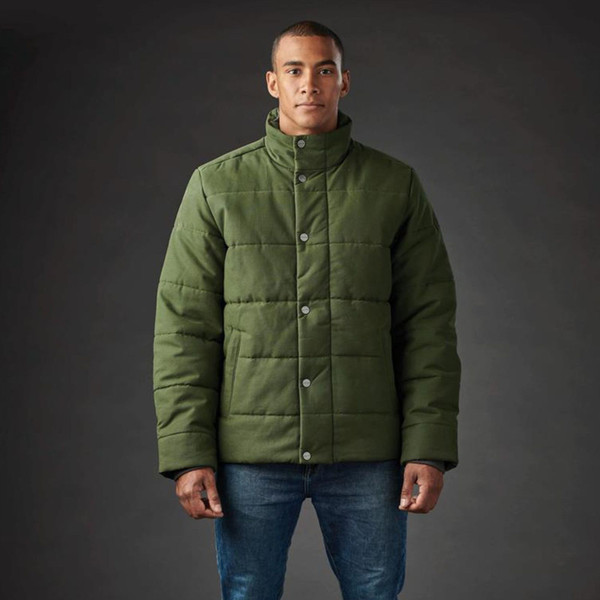 Man wearing olive green quilted canvas jacket with stand collar and snap button front placket