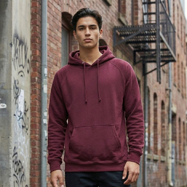 Mens Fleecy Plain Hoodie in Maroon, worn by a model posing in a alleyway.