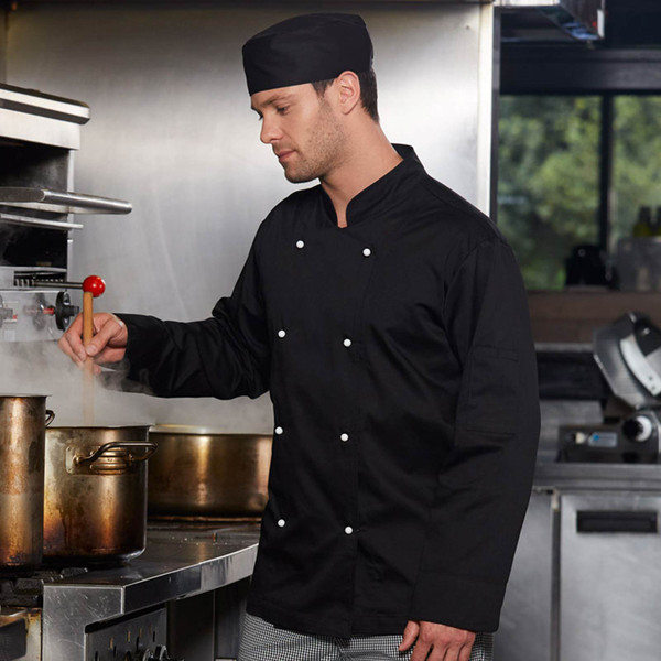 Black double-breasted chef jacket with white press stud closures and matching skull cap worn in commercial kitchen