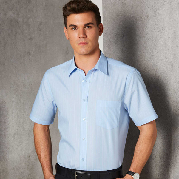 Man wearing light blue pin stripe short sleeve business shirt with chest pocket and button placket