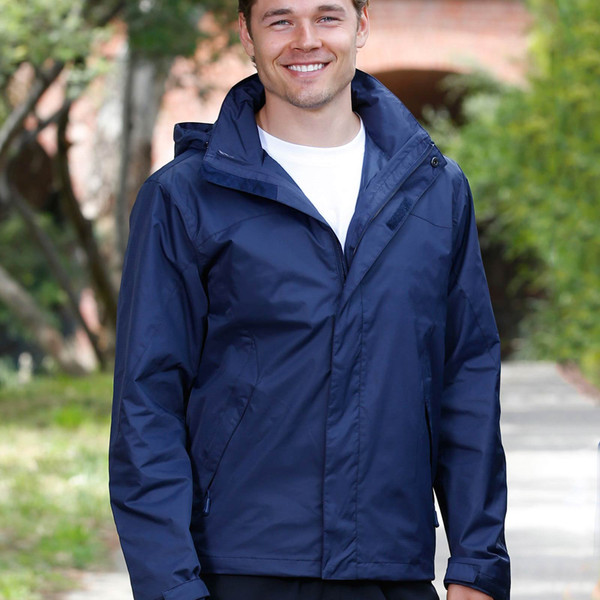 Navy storm jacket with concealed hood and protective front flap worn over white tee