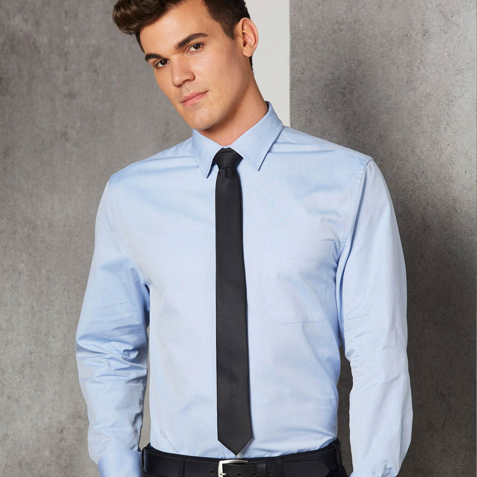 Light blue Oxford weave dress shirt with classic collar and long sleeves worn with black tie