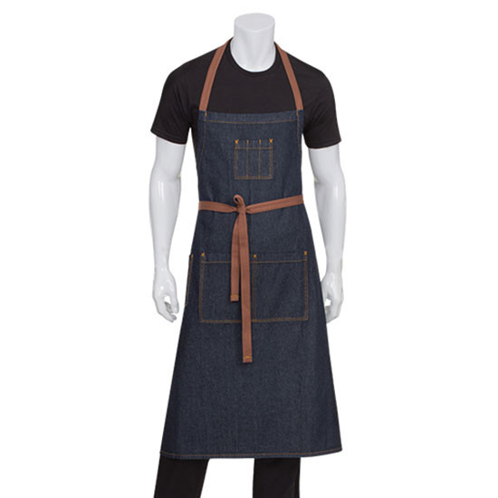 Dark indigo denim bib apron with tan leather-look straps and contrast stitching worn by male model